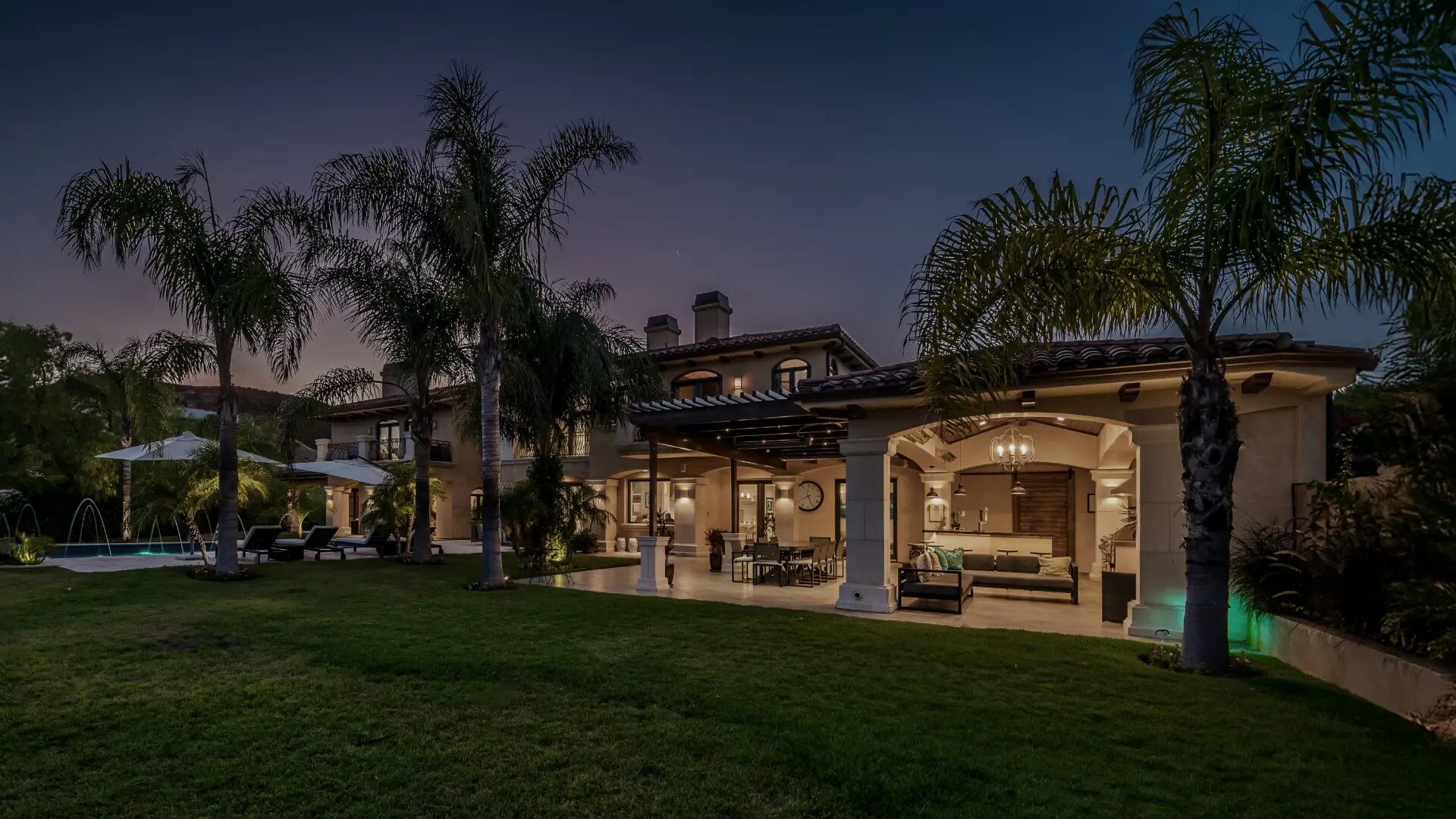 Modern luxury home at dusk representing Rock Solid Group listings